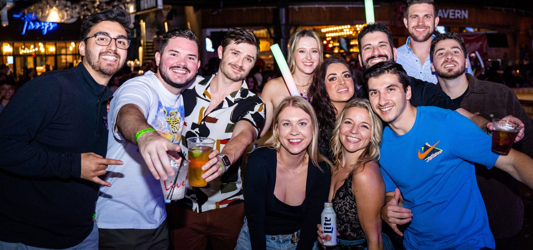 A group of guys and girls enjoying their bachelor and bachelorette party