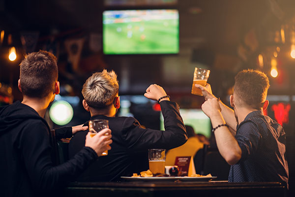 Fans watching nfl playoffs at sports bar