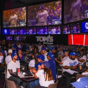 Los Angeles Dodgers fans watching a game at Tom's Watch Bar LA Live